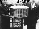 Harold A. Rosen (R) with the engineer Thomas Hudspeth and the satellite prototype Syncom at the Eiffel Tower in 1961. [Boeing Aircraft photo]